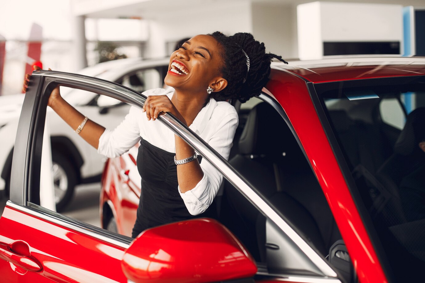 stylish-black-woman-car-salon_1157-21421